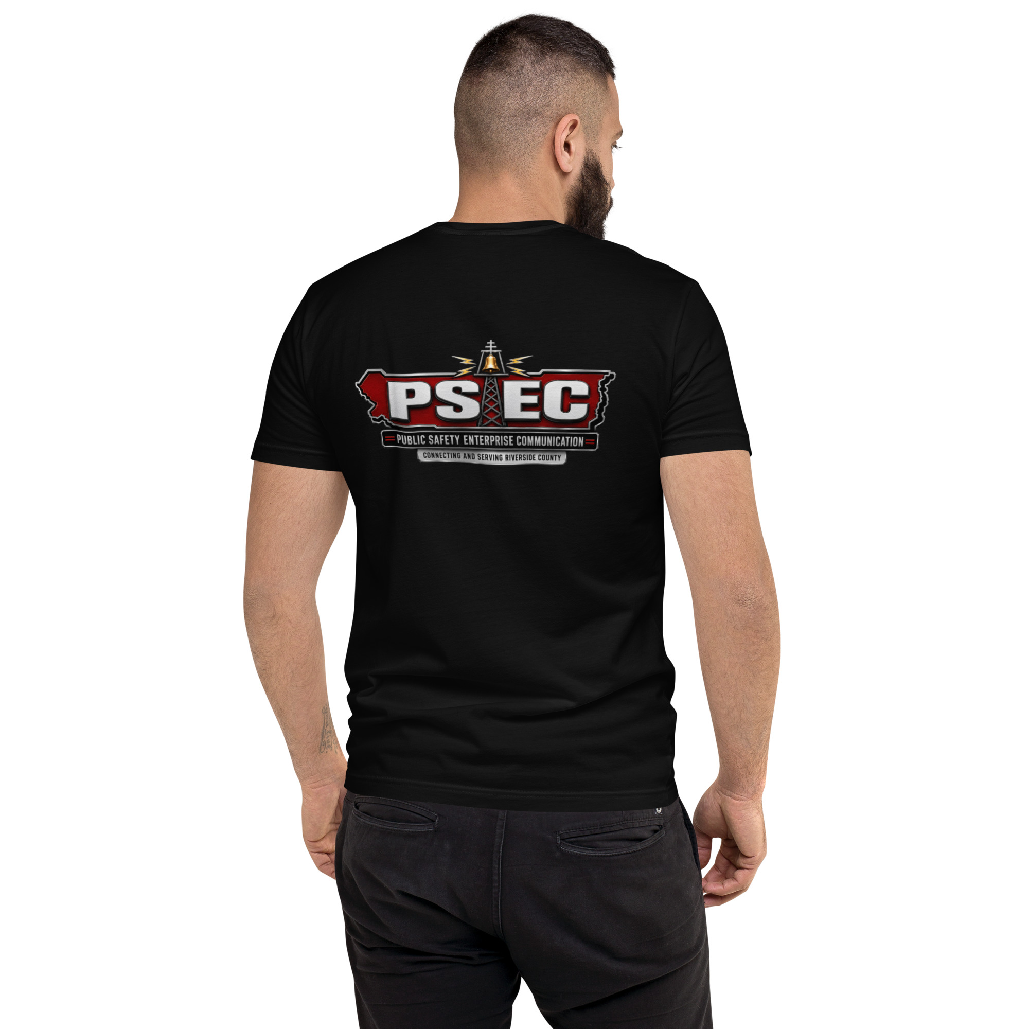 A person wearing a black t-shirt displaying the logo of 'PS EC' with the text 'Public Safety Enterprise Communication' on the back.